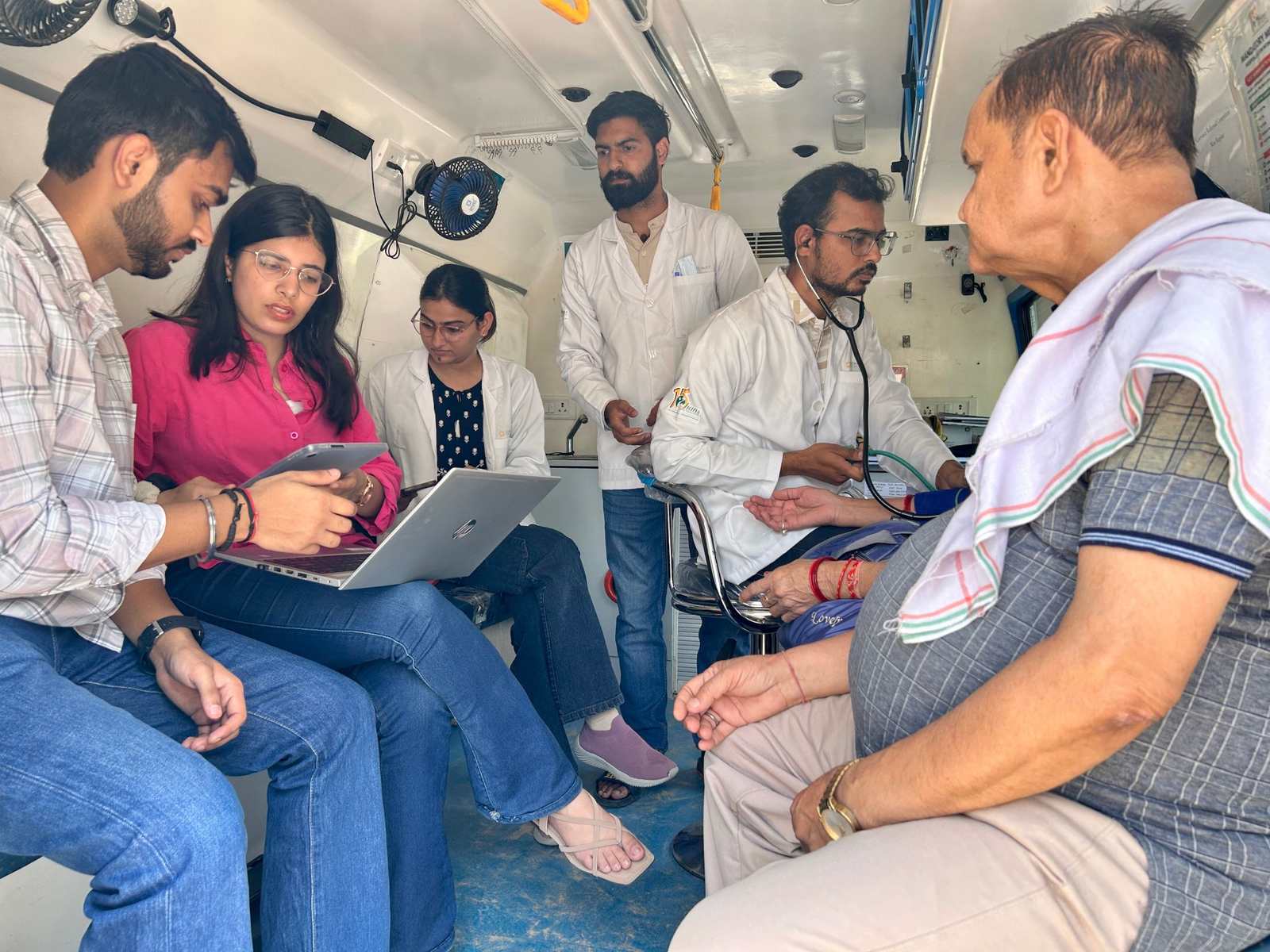 A mobile health unit collecting beneficiary data in the field